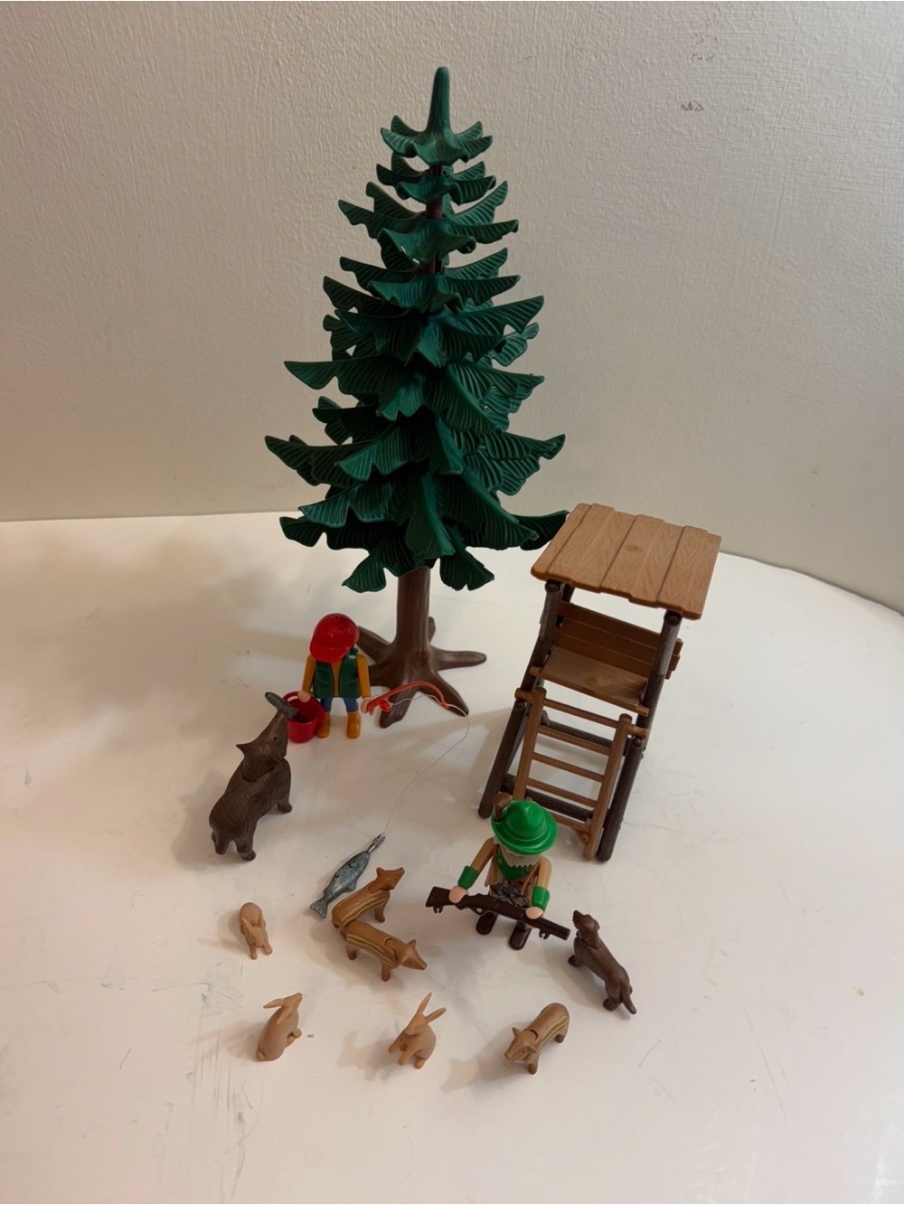 Play mobile Forest Ranger’s Post and vintage fisherman figure with fish